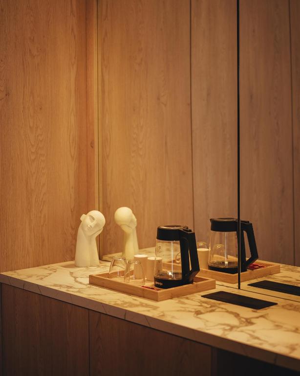 In-room coffee station on marble counter with sculptural details