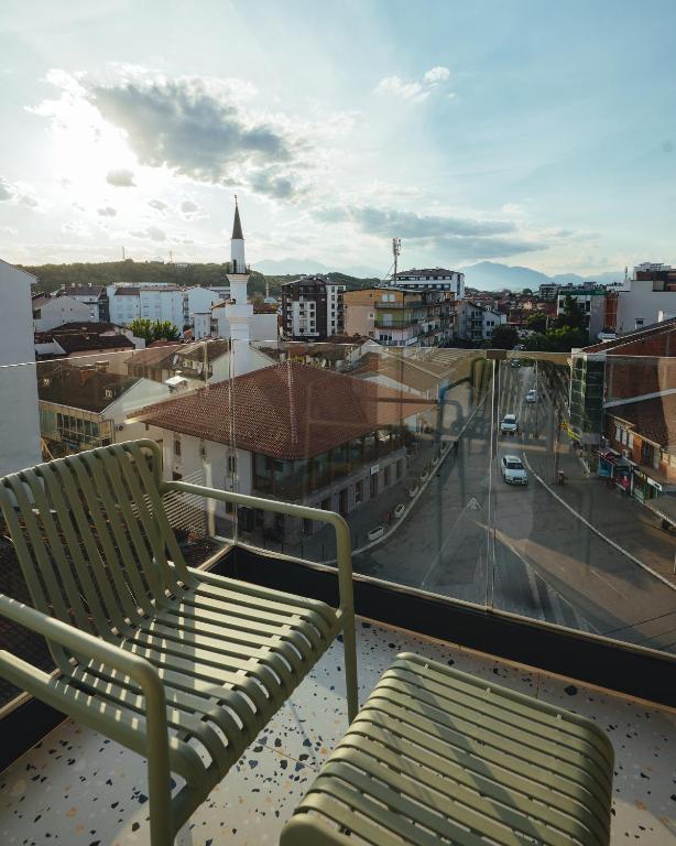 Private balcony overlooking Gjakovë rooftops and minaret